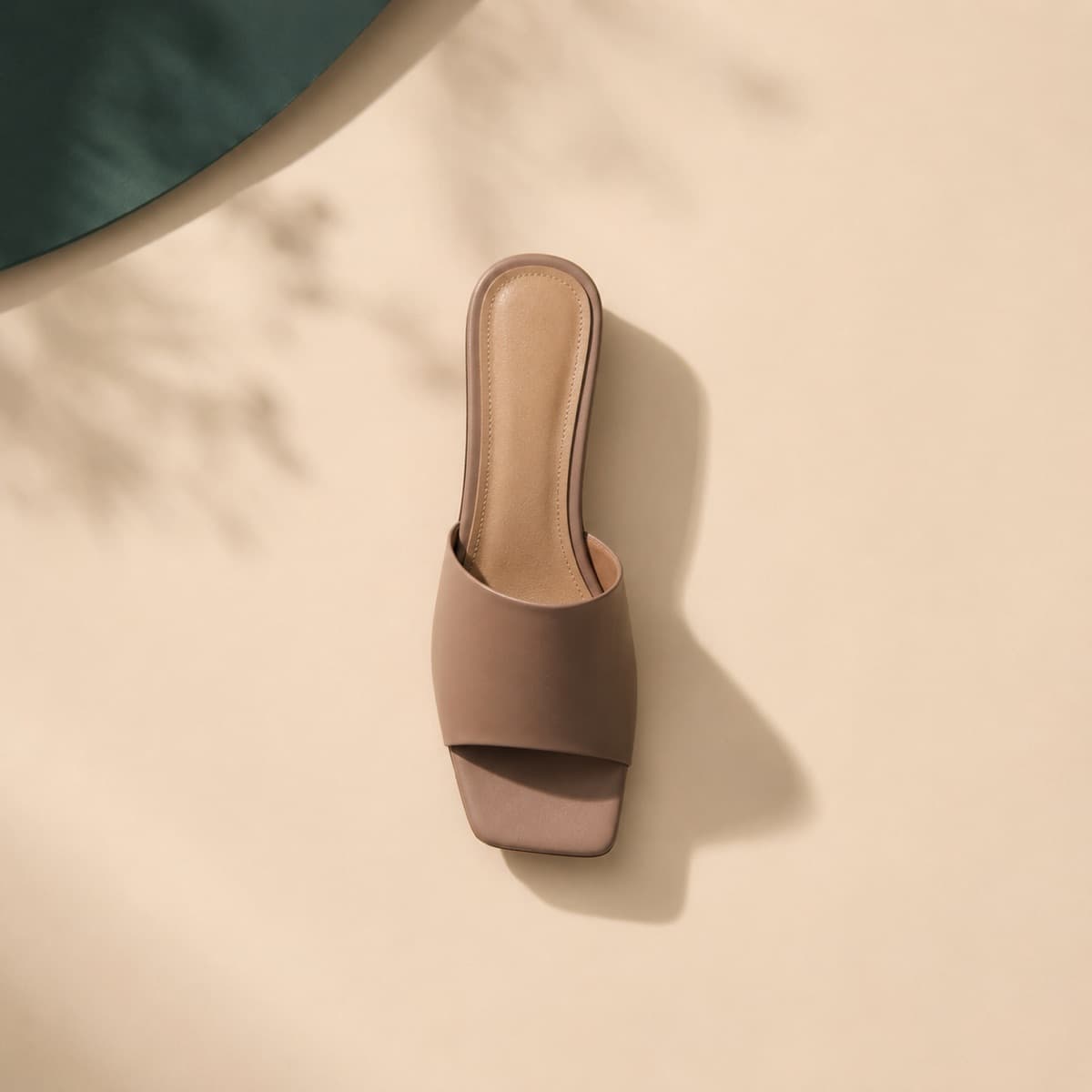 Mule Square Toe, photographed from above against a sand-beige background