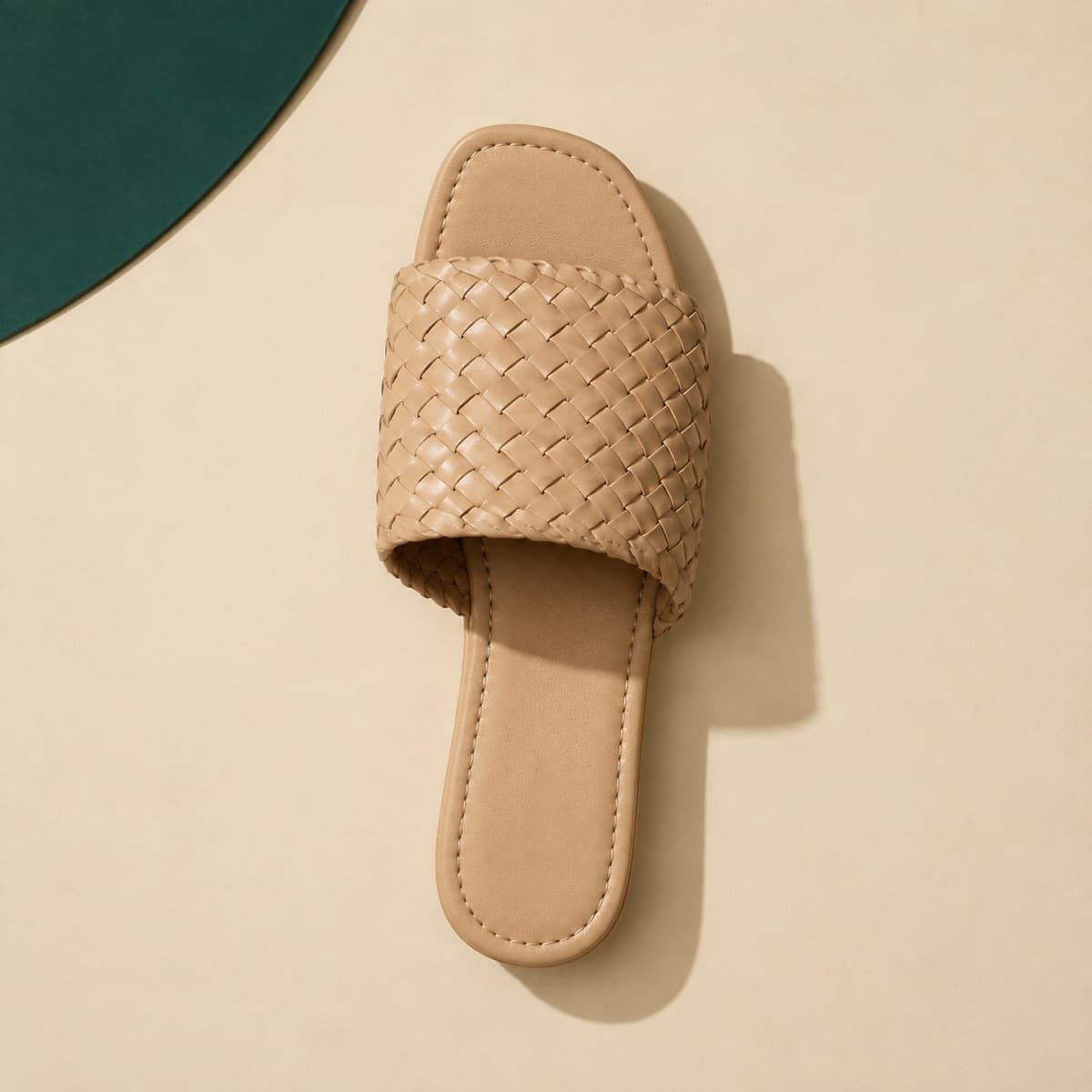 Slide Woven, photographed from above against a sand-beige background