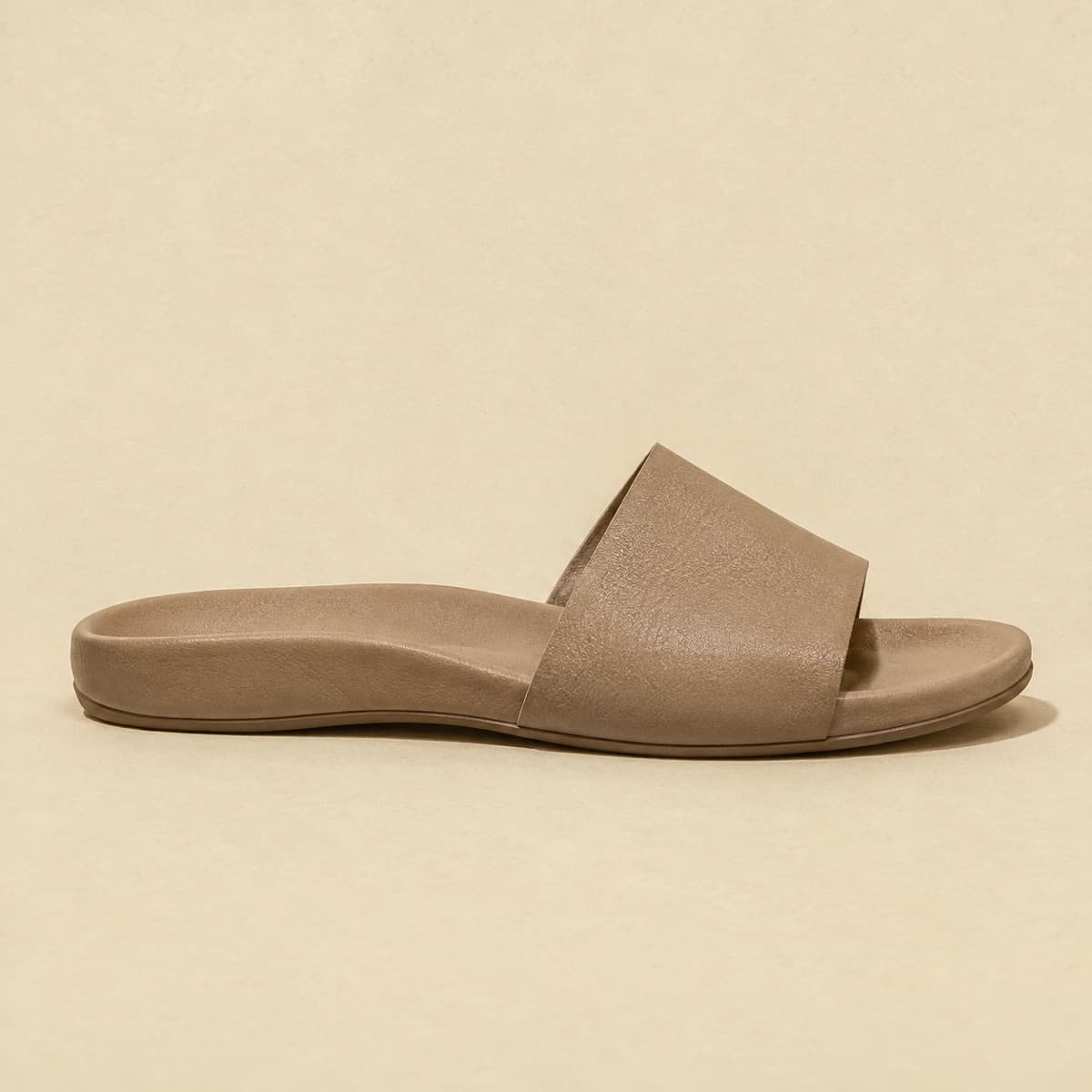Slide Contoured Bed, photographed from above against a sand-beige background