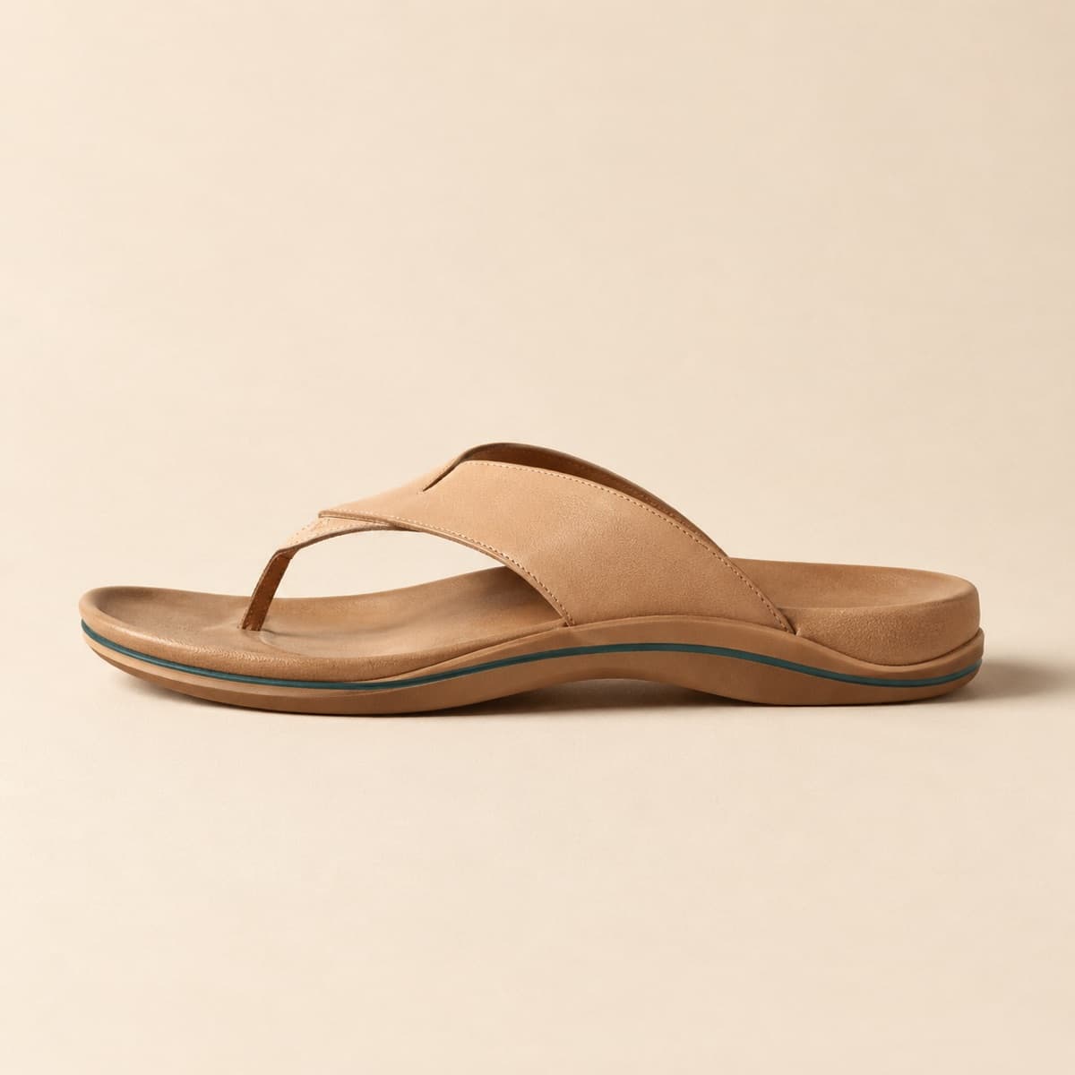 Toe-Post Contoured, photographed from above against a sand-beige background