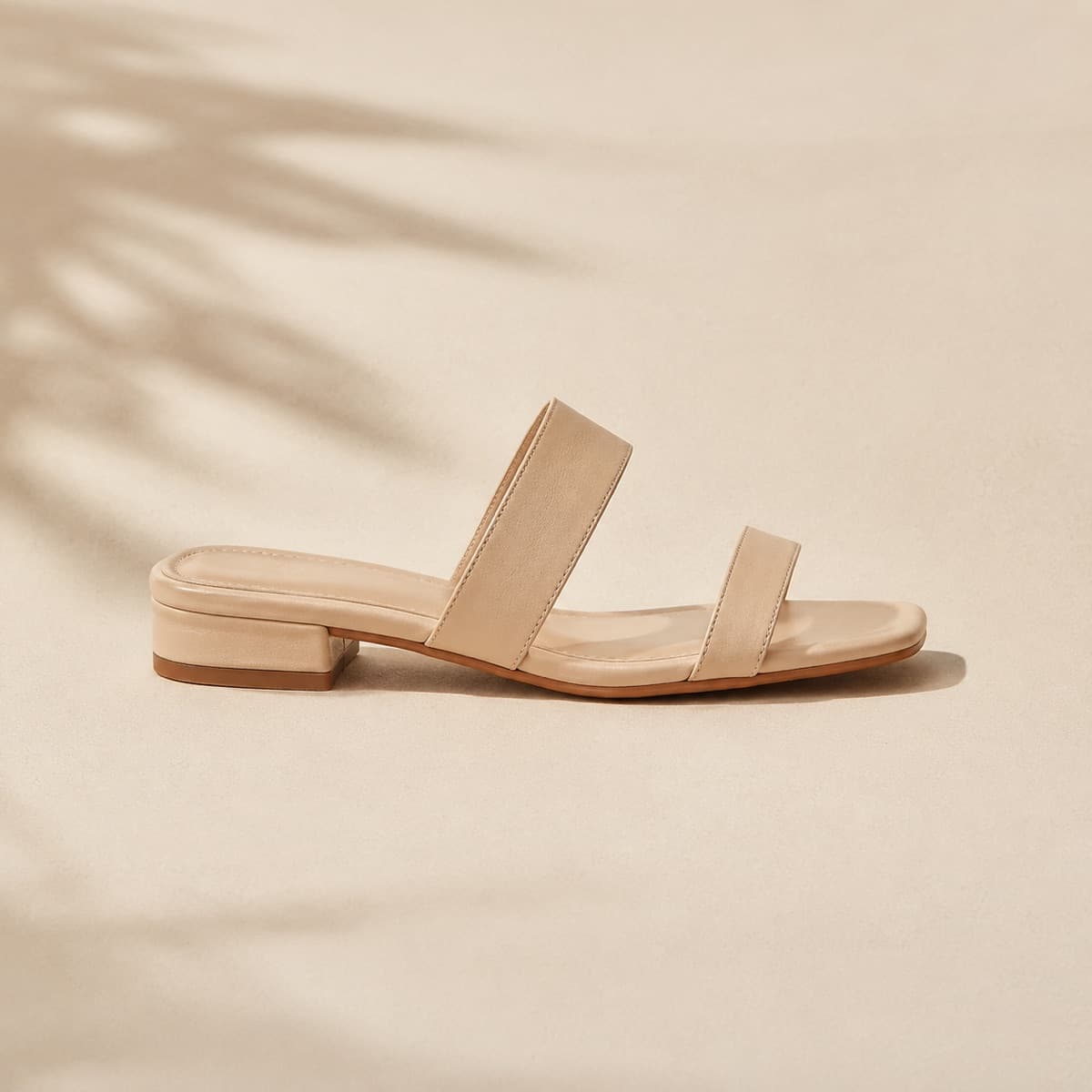 Block Heel 25 mm, photographed from above against a sand-beige background