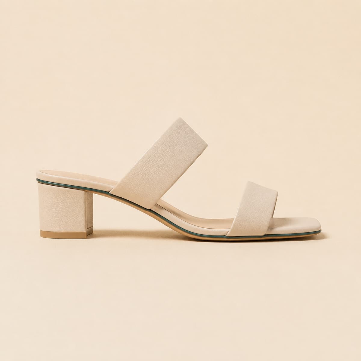 Block Heel 35 mm, photographed from above against a sand-beige background