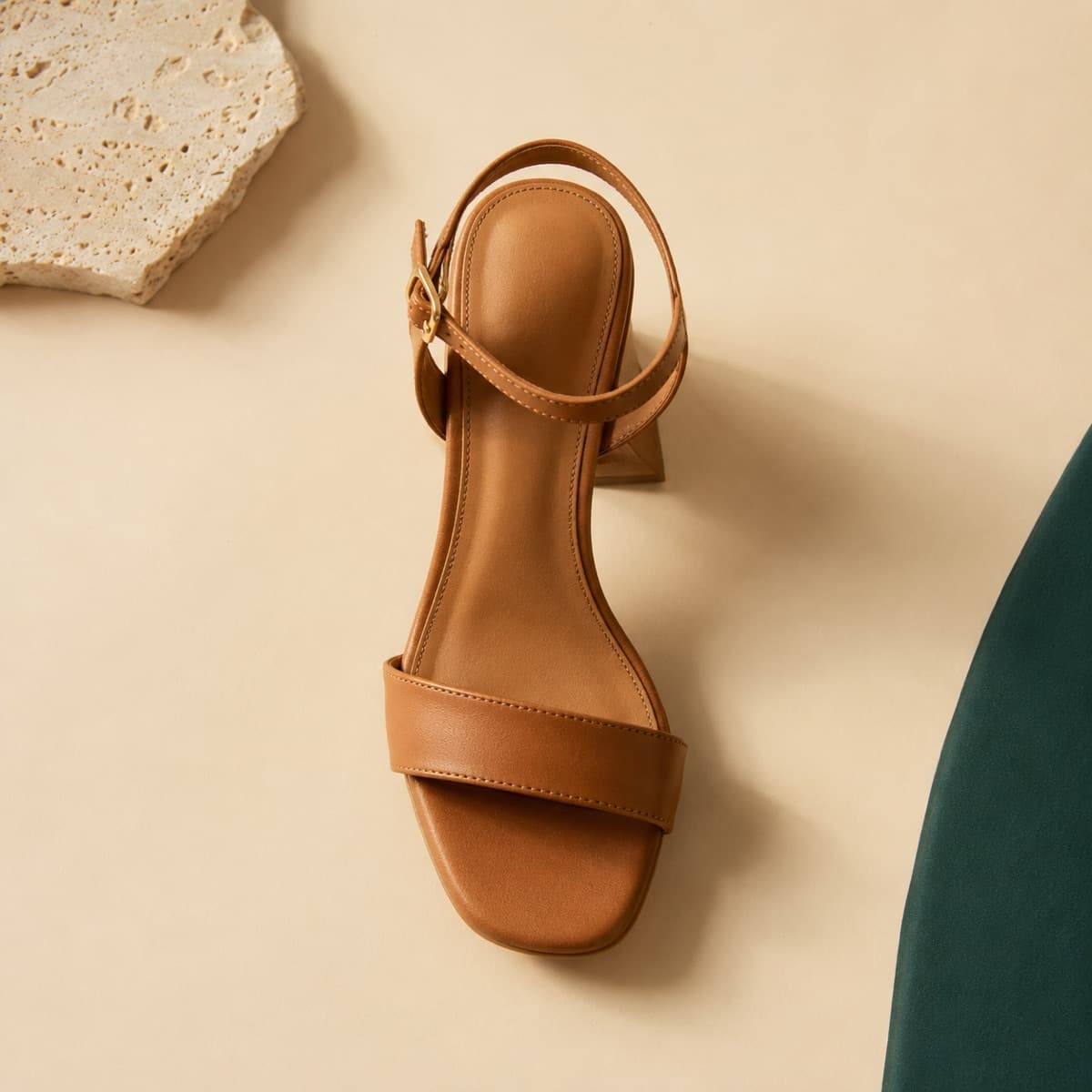 Heel Premium, photographed from above against a sand-beige background